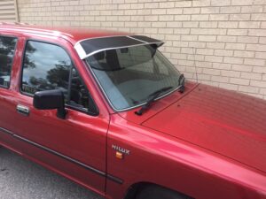toyotahilux8895roofrackworldsa2.jpg Toyota Hilux 10/88-10/97 Mesh Windscreen Sunvisor